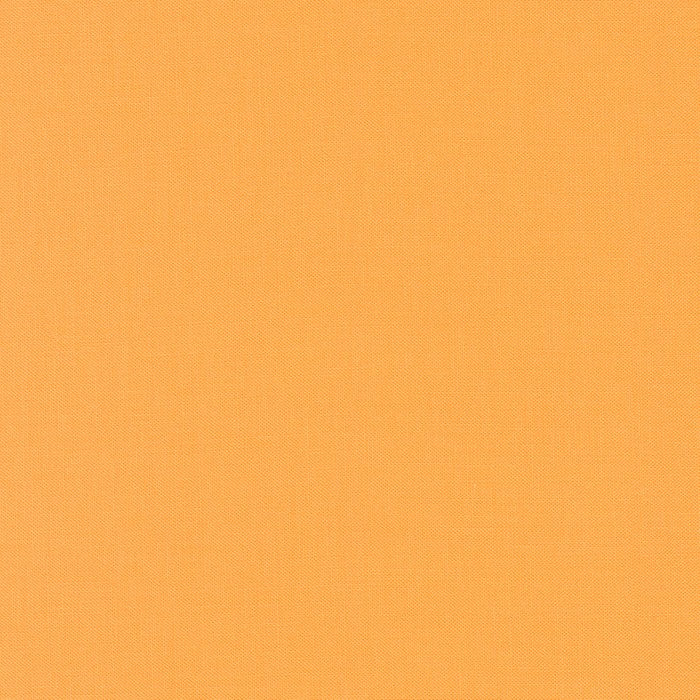 Kona Cotton Solids (The Orange Shades) in Mac And Cheese quilting fabric by Robert Kaufman